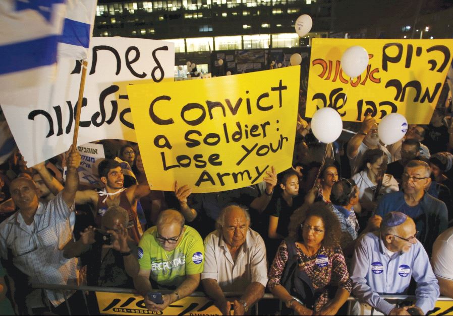 SUPPORTERS OF Elor Azaria  take part in a protest. (Reuters)