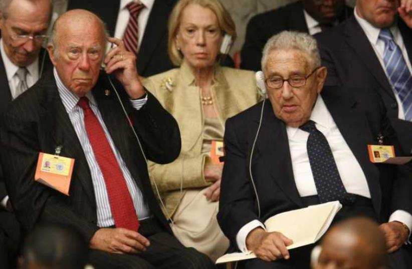 Former US Secretaries of State Henry Kissinger (R) and George Shultz attend a Security Council Summit meeting during the United Nations General Assembly at UN headquarters in New York (photo credit: REUTERS)