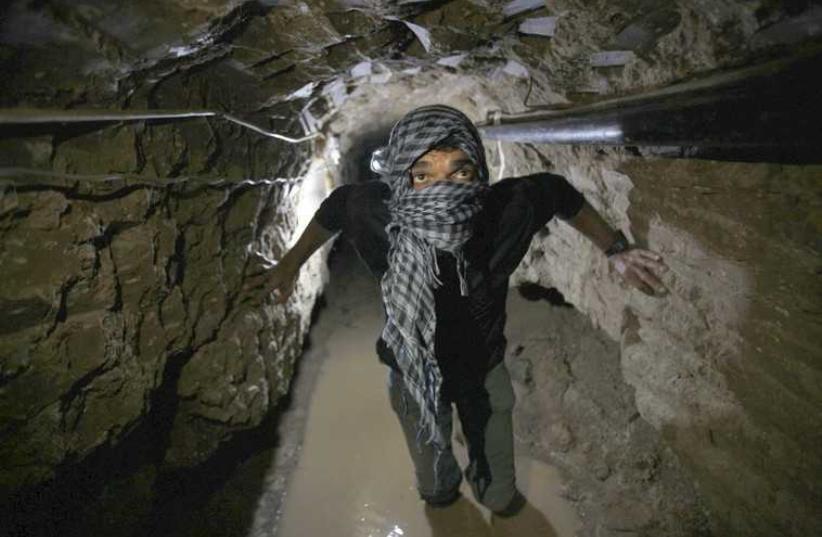 A smuggling tunnel beneath the Egyptian-Gaza border in Rafah [File] (photo credit: REUTERS)