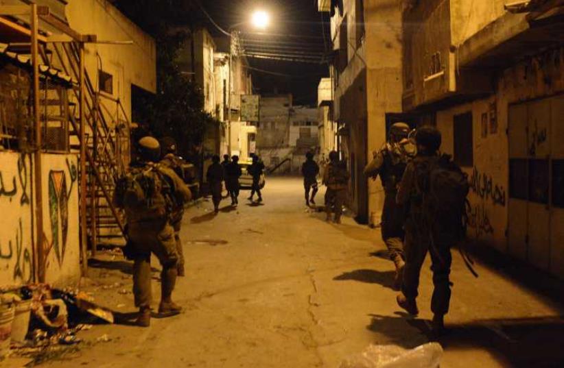 IDF troops operating in the West Bank (photo credit: IDF SPOKESMAN’S UNIT)