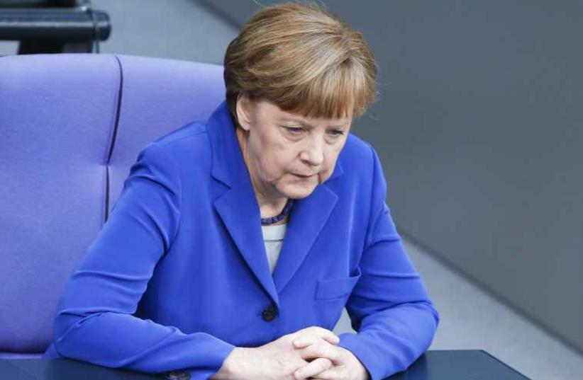 German Chancellor Angela Merkel commemorates the centenary of the massacre of 1.5 million Armenians by Ottoman Turk forces, during a regular session of the German lower house of Parliament, April 24 (photo credit: REUTERS)