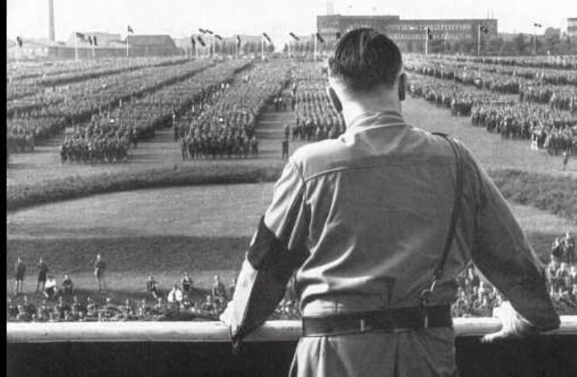 German chancellor Adolf Hitler looks out at a rally staged by the Nazi Party (photo credit: Courtesy)