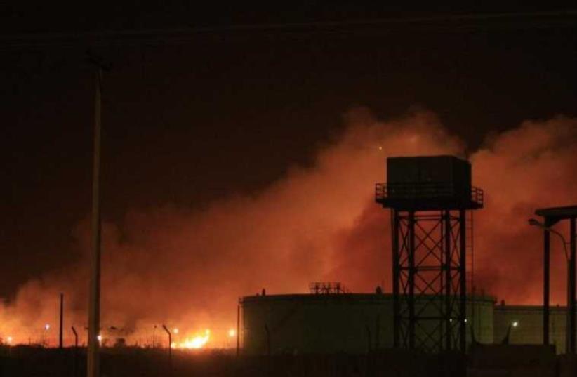 Fire engulfs the Yarmouk ammunition factory in Khartoum (photo credit: REUTERS)