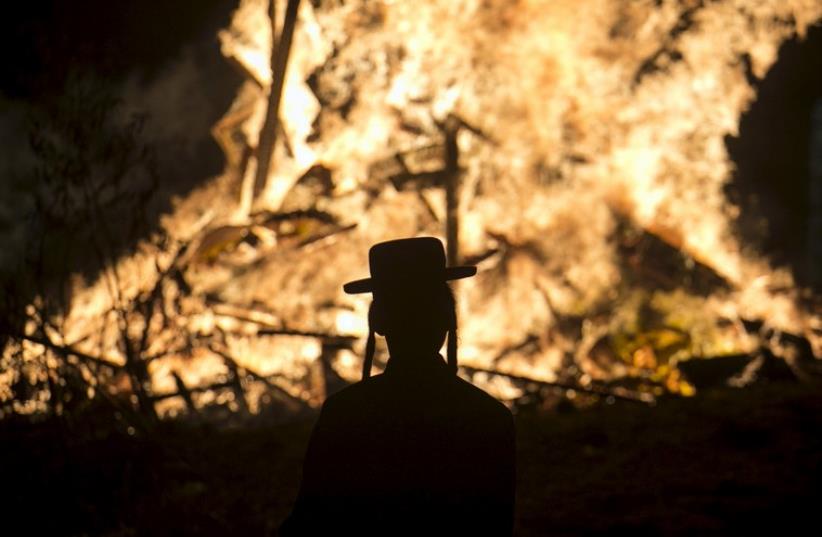 A bonfire during Lag Ba'omer festivities in Bnei Brak  (photo credit: REUTERS)