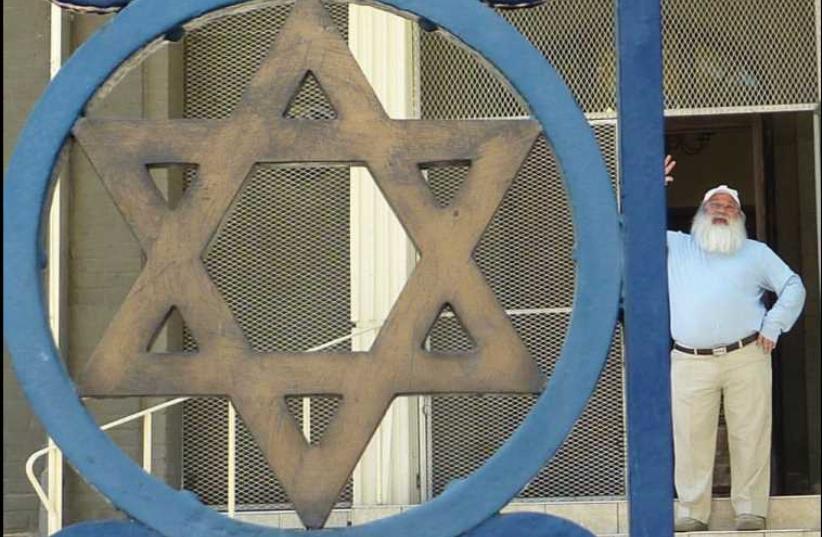 The Windhoek Hebrew Congregation synagogue in Namibia, with community leader Zvi Gorelick in the background. (photo credit: ORI GOLAN)