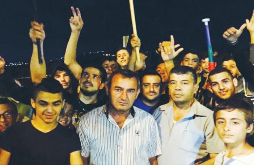 JABER HAMOUD (second left), head of the Druse and Circassian Local Councils Forum, protests in Sajur Sunday.  (photo credit: SOHEL MUSTAFA)