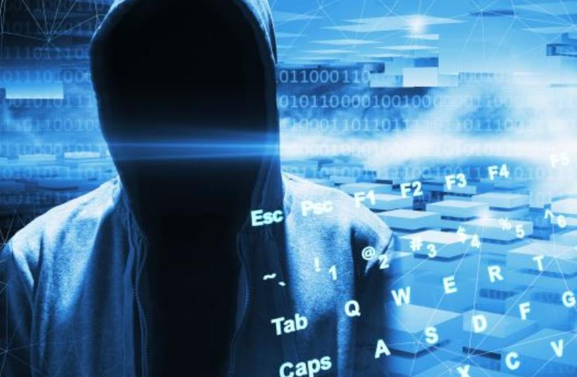 Illustrative image of a computer hacker (photo credit: INGIMAGE)