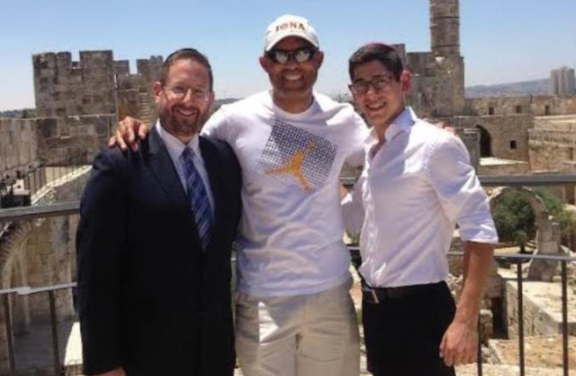 FORMER YANKEES star Mariano Rivera flanked by Rabbi Dov Lipman and Shlomo Lipman in the capital. (photo credit: Courtesy)