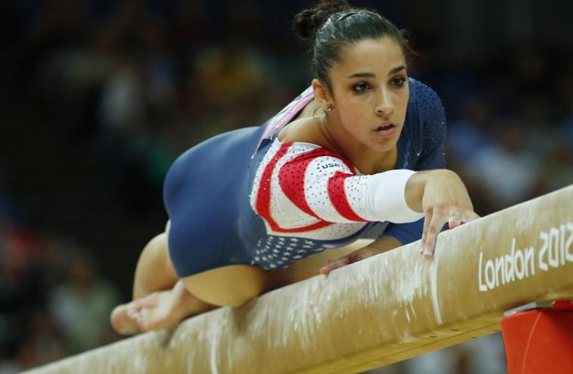 Alexandra Raisman of the US competes in the women's gymnastics balance beam final in the North Greenwich Arena during the London 2012 Olympic Games (photo credit: REUTERS)