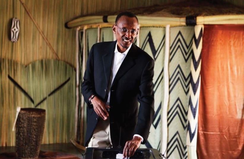 RWANDAN PRESIDENT Paul Kagame casts his ballot during the presidential election in Kigali in 2010 (photo credit: REUTERS)