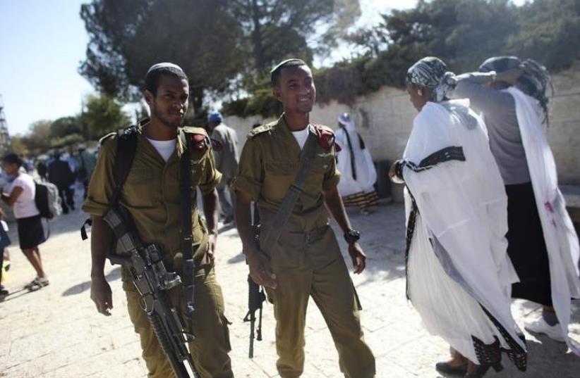 IDF soldiers take part in a ceremony marking the Ethiopian Jewish holiday of Sigd  (photo credit: REUTERS)