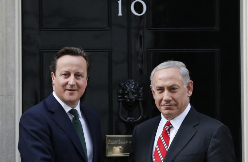 Britain's Prime Minister David Cameron (L) greets Prime Minister Benjamin Netanyahu at Number 10 Downing Street in London, April 17, 2013 (photo credit: REUTERS)