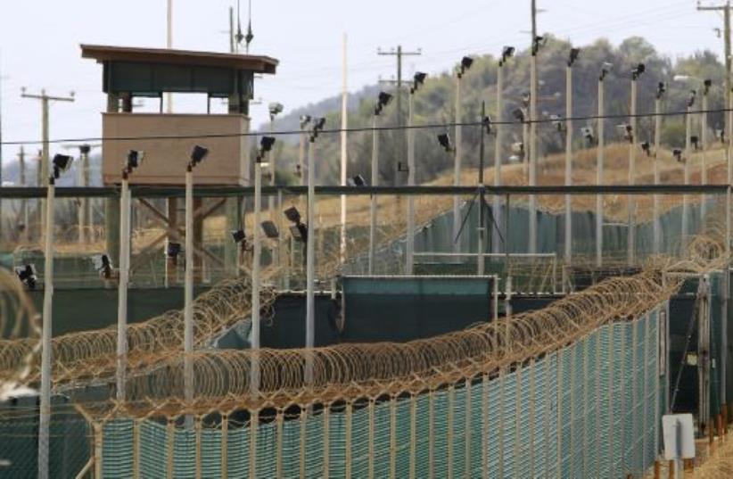 The exterior of Camp Delta is seen at the U.S. Naval Base at Guantanamo Bay, March 6, 2013. The facility is operated by the Joint Task Force Guantanamo and holds prisoners who have been captured in the war in Afghanistan and elsewhere since the September 11, 2001 attacks.  (photo credit: REUTERS)