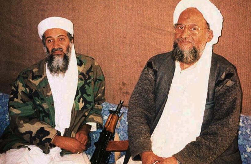 al-Qaida cheif Ayman al-Zawahiri sits with predecessor Osama Bin Laden during an interview in 2001  (photo credit: REUTERS)