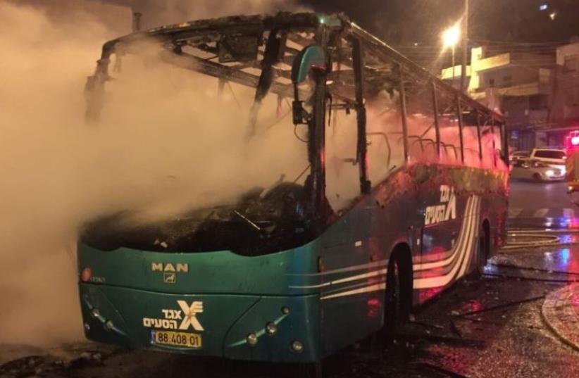 Israeli bus that went up in flames after being struck by a Molotov cocktail in Ras el-Amoud (photo credit: JERUSALEM FIRE AND RESCUE SERVICES)