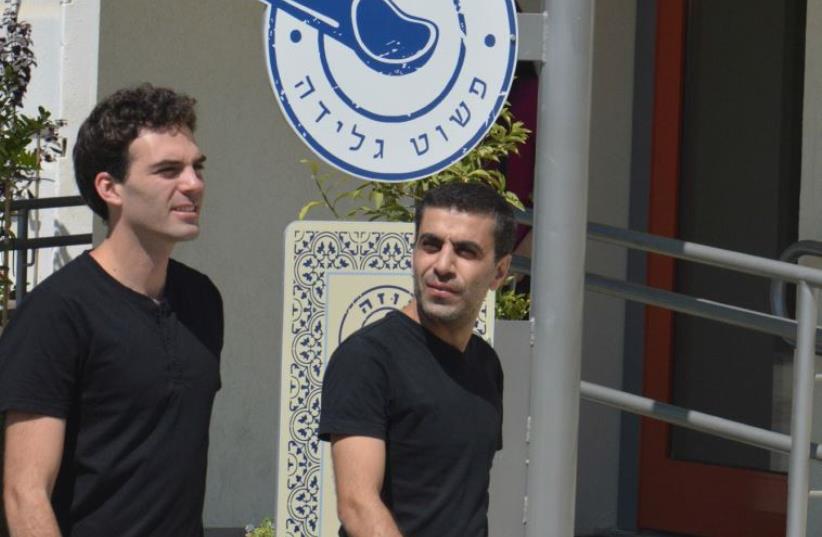 Founders Adam Ziv (left) and Alaa Sweetat at the Buza shop and production center at Kibbutz Sasa (photo credit: GUY RAIVITZ)