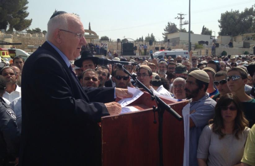 President Reuven Rivlin speaks at the funeral of Eitam and Na'ama Henkin  (photo credit: GUSH ETZION REGIONAL COUNCIL)