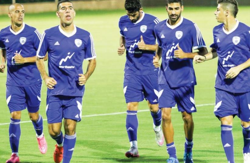 The Israel national squad was in an upbeat mood yesterday at the Shefayim training complex as it began its preparations for its final two Euro 2016 qualifiers. (photo credit: ADI AVISHAI)