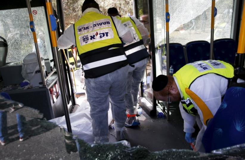 Members of Zaka Rescue and Recovery team at the scene of terror attack in Armon Hanatziv, Jerusalem (photo credit: REUTERS)