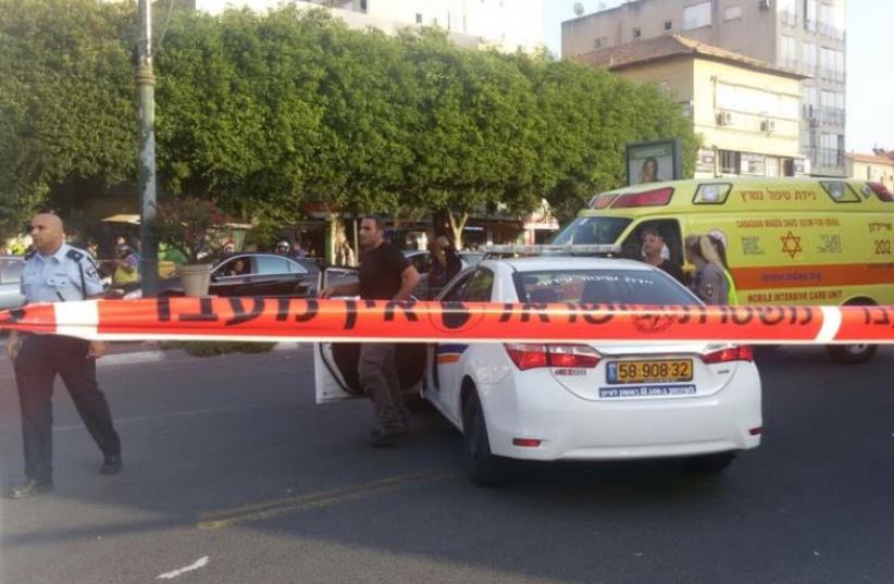 Police car at crime scene (photo credit: SHLOMI)