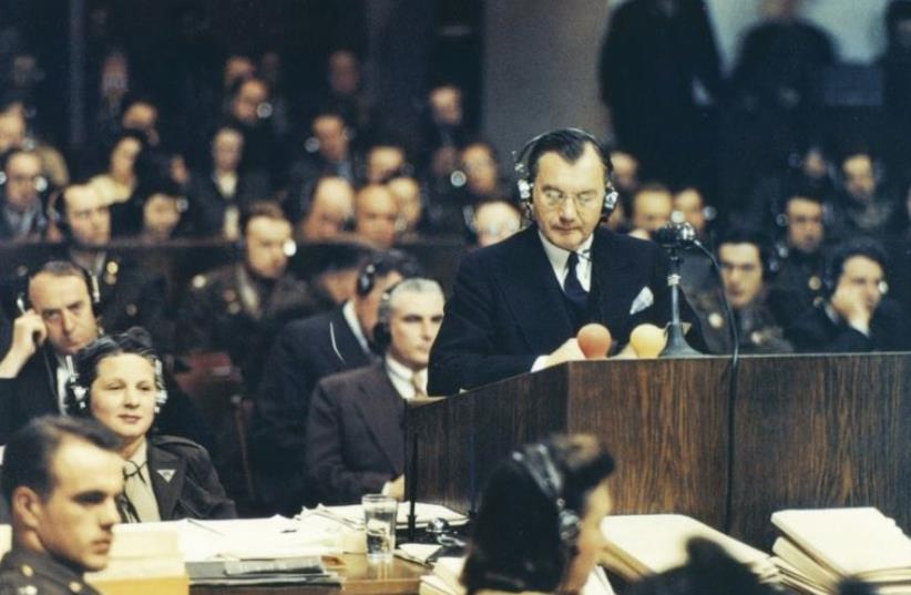 Chief American prosecutor Robert H. Jackson addresses the Nuremberg court on November 20, 1945 (photo credit: Wikimedia Commons)