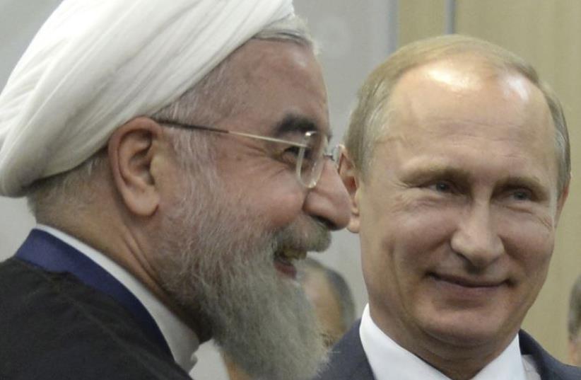 President Vladimir Putin (R) meets with Iran's President Hassan Rouhani in Ufa, Russia (photo credit: REUTERS)