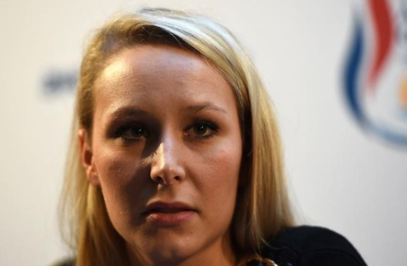 Vice-President of the French far-right Front National (FN) party and candidate for the regional elections in the Provence-Alpes-Cote d'Azur (PACA) region, Marion Marechal Le Pen, answers journalists' questions during a press conference (photo credit: AFP PHOTO)