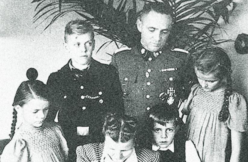 THE HÖSS family (from left to right) Ingebrigitt; Klaus; Rudolf’s wife Hedwig, holding Annegret; Rudolf Hoess, Hans- Rudolf (Rainer’s father); and Heidetraut. (photo credit: COURTESY RAINER HOSS)