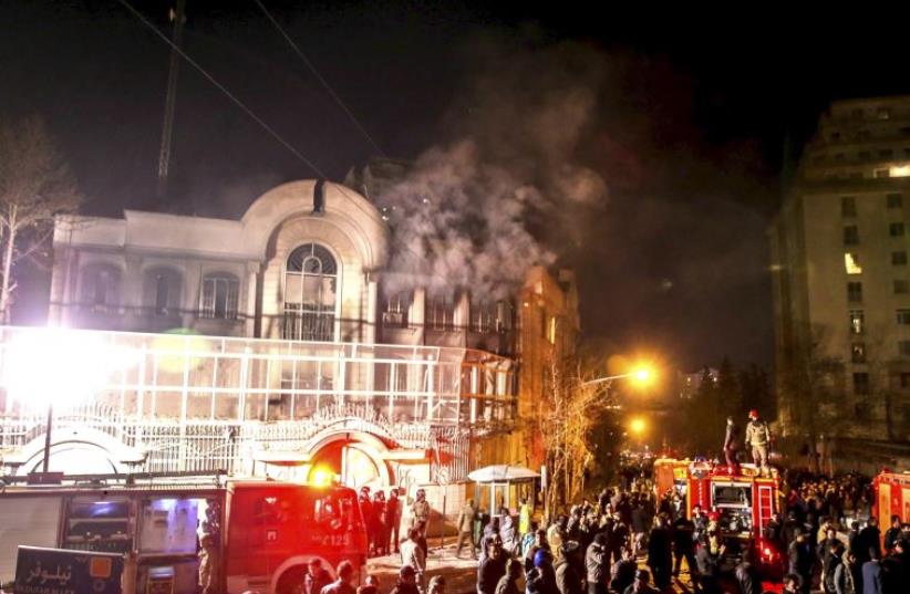 Flames rise from Saudi Arabia's embassy during a demonstration in Tehran January 2, 2016 (photo credit: REUTERS)