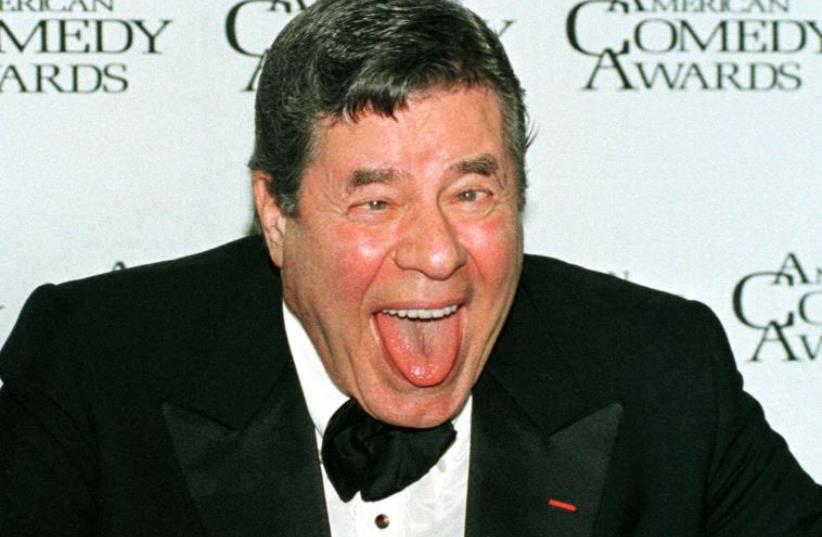 Comedian Jerry Lewis clowns around after receiving the Lifetime Achievement Award at the 12th annual American Comedy Awards, February 22, 1998, in Los Angeles  (photo credit: REUTERS)