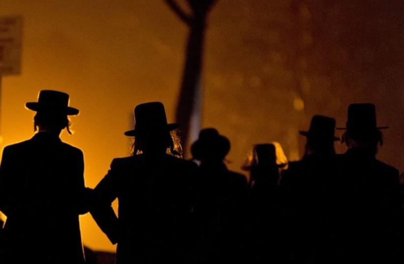 Hassidic Jews arrive at a mass gathering in Brooklyn (photo credit: REUTERS)