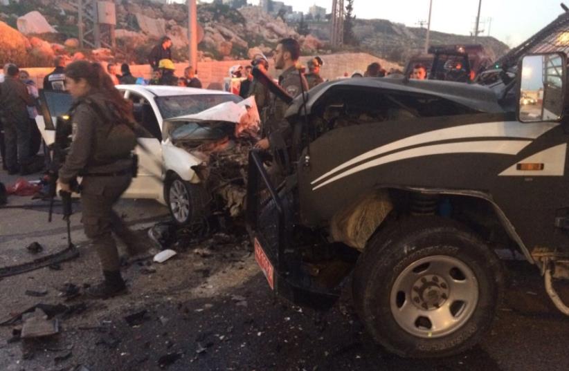 Scene of car-ramming attack near Ma'aleh Adumin, February 13, 2016. (photo credit: ARIK ABULOF/JERUSALEM FIRE AND RESCUE)