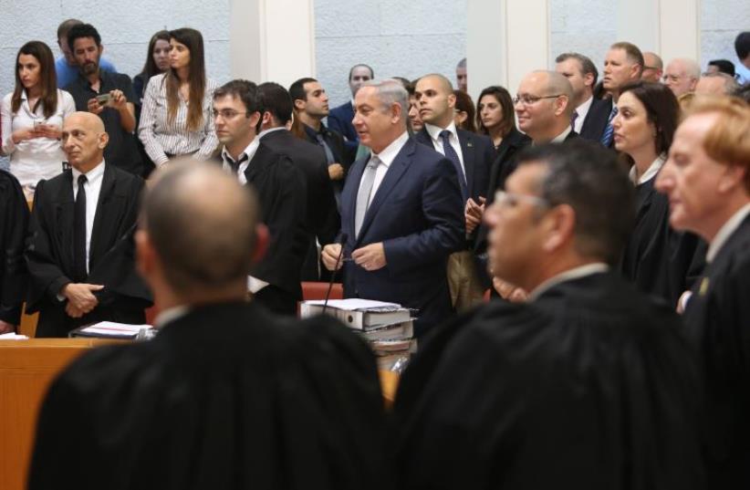 Prime Minister Benjamin Netanyahu addresses the High Court on the gas deal (photo credit: GIL YOCHANAN/POOL)