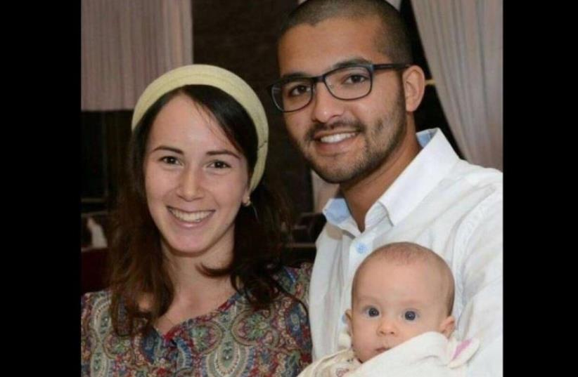 IDF Sgt. Tuvia Yanai Weissman (R), his wife, and baby (photo credit: IDF SPOKESPERSON'S UNIT)