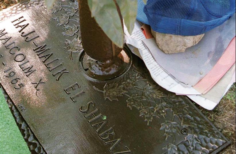 THE GRAVE of civil rights leader Malcolm X at Ferncliff Cemetery in Ardsley, New York. (photo credit: REUTERS)