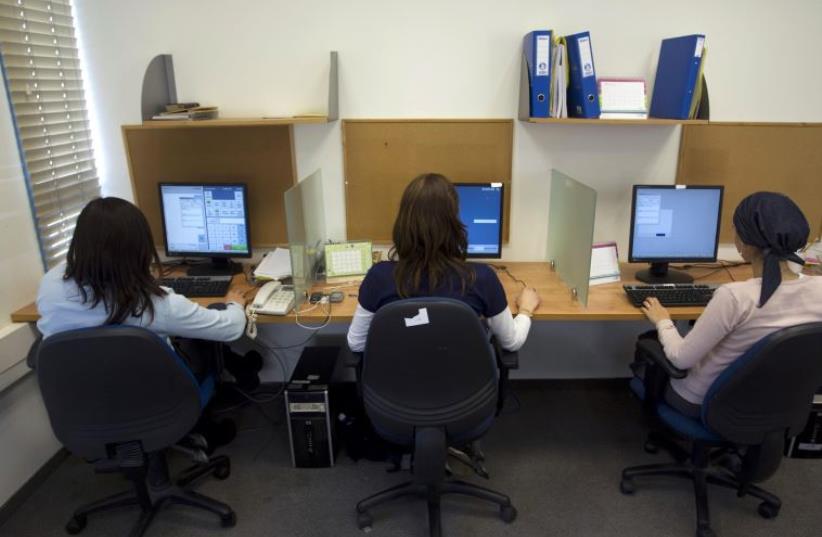 Ultra-Orthodox women work at Matrix Global, a hi-tech company, in the West Bank Jewish settlement of Modiin Illit April 3, 2011 (photo credit: REUTERS)