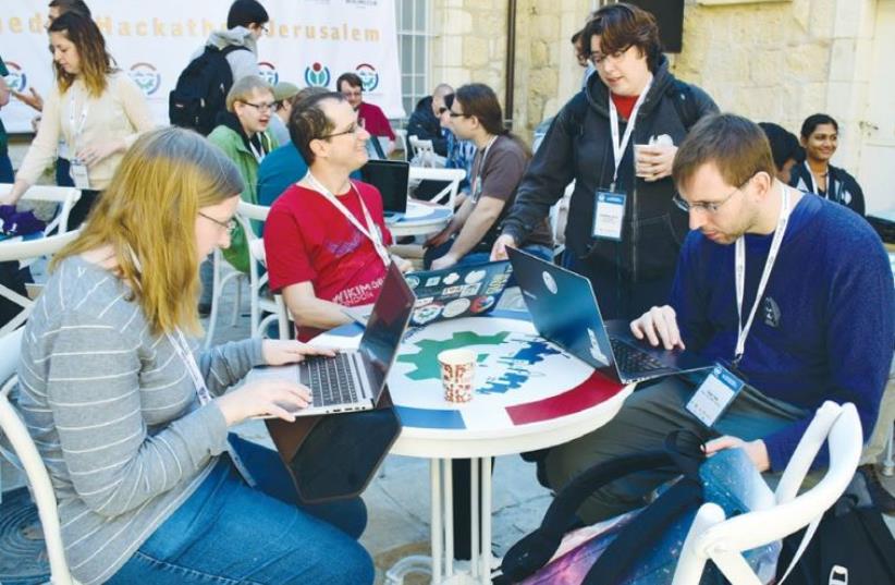 SOFTWARE DEVELOPERS from Israel and abroad work to improve the Wikipedia online encyclopedia at Hansen House in Jerusalem over the weekend (photo credit: ARIEL ELINSON)