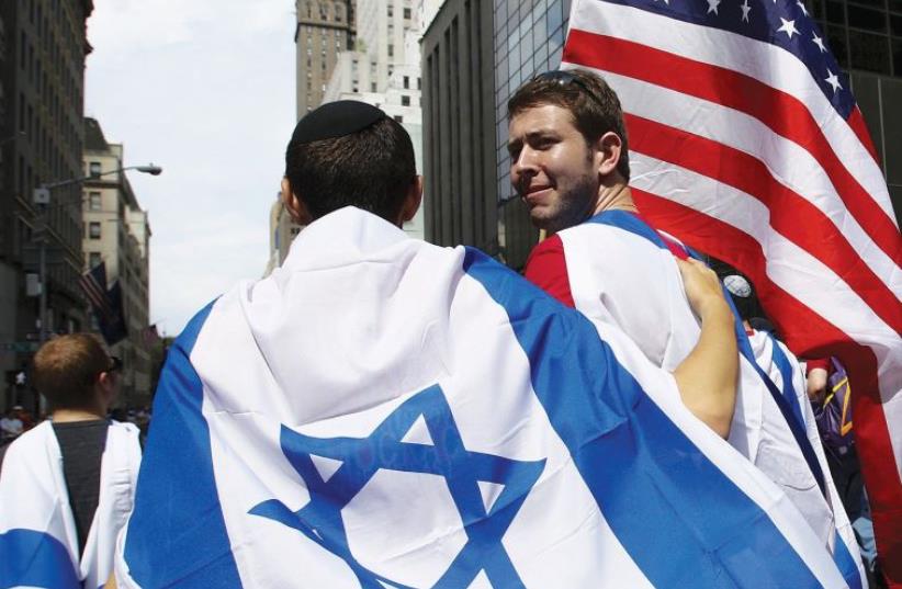People take part in the 51st annual Israel parade in New York City last year (photo credit: REUTERS)