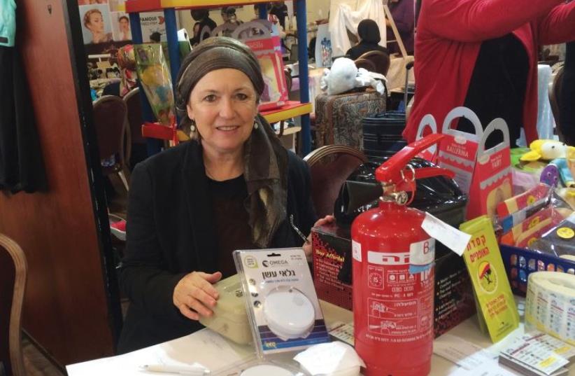 Representing Keren Yosef at a health fair (photo credit: COURTESY YEHUDIS SCHAMROTH)