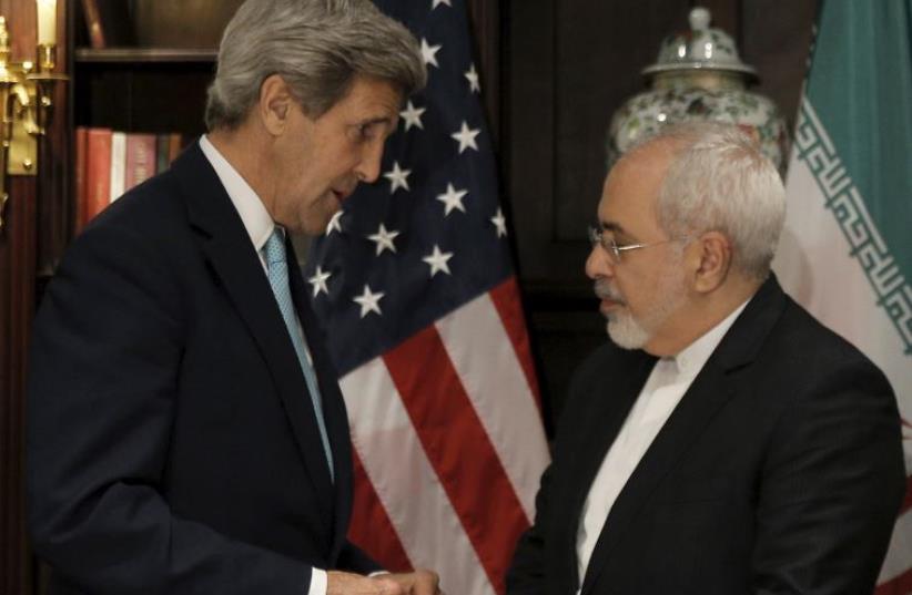 US Secretary of State John Kerry (L) meets with Iran's foreign minister, Mohammad Javad Zarif, in Manhattan (photo credit: REUTERS)