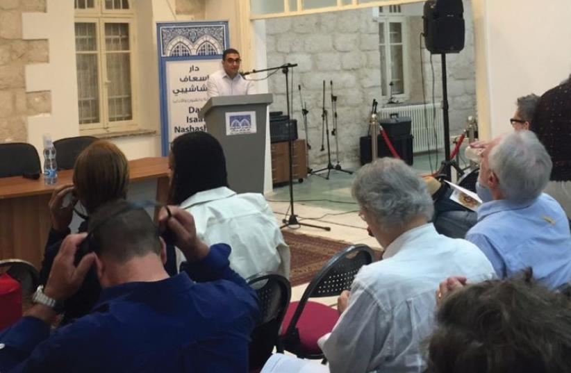 Crowds gather for the opening of the Jerusalem session of the Palestine Festival of Literature at Dar Issaf Nashashibi house in Sheikh Jarrah (photo credit: SETH J. FRANTZMAN)