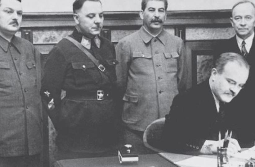 The Soviet leadership with (standing at left) Central Committee secretary Andrei Zhdanov. (Leader Joseph Stalin is standing second from right.) (photo credit: Wikimedia Commons)