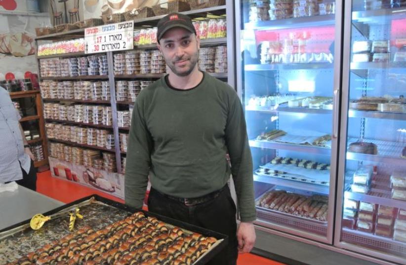 Itzik Ozarko, the owner of Marzipan bake shop in Machane Yehuda market, Jerusalem. Known for chocolate rugelach (photo credit: CHRISTINA GAROFALO/FLICKR)