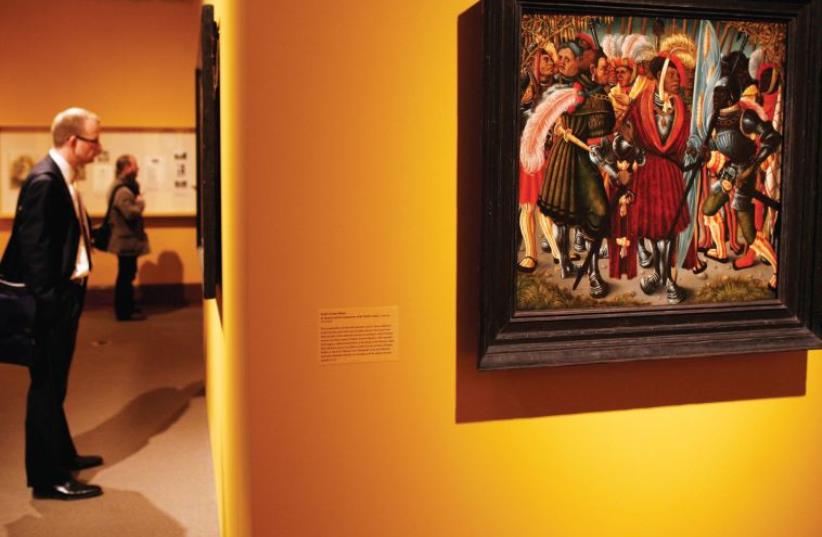 THE PAINTING ‘St. Maurice and His Companions of the Theban Legion’ by an unknown South German artist is displayed in an exhibition of Old Master paintings entitled ‘Reclaimed: Paintings from the Collection of Jacques Goudstikker’ at the Jewish Museum in New York, 2009. (photo credit: SHANNON STAPLETON / REUTERS)