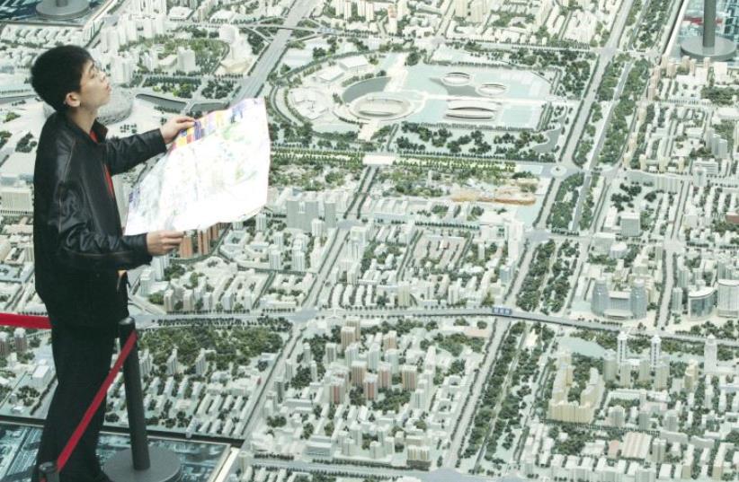 MISSING THE trees for the forest, city planners are increasingly allowed to smother architects. (photo credit: REUTERS)