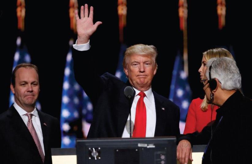 Republican presidential nominee Donald Trump waves during his walk through at the Republican National Convention in Cleveland on July 21 (photo credit: REUTERS)