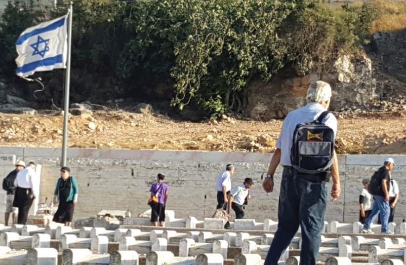 Reciting the Kaddish prayer at the city’s ancient Jewish cemetery (photo credit: BEN BRESKY)