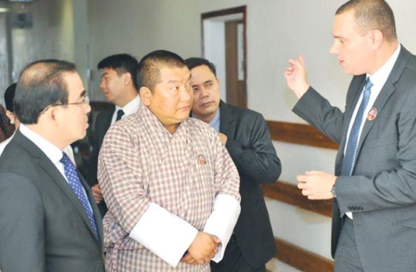 YARON TAMIR of Agrostudies speaks to Bhutanese Agriculture Minister Lyonpo Yeshey Dorji (center) and Cambodian Agriculture Minister Veng Sakhon in Jerusalem. (photo credit: ADI TURGEMAN)