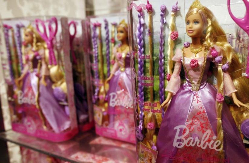 A Barbie doll is seen inside the FAO Schwartz toy store in New York (photo credit: REUTERS)