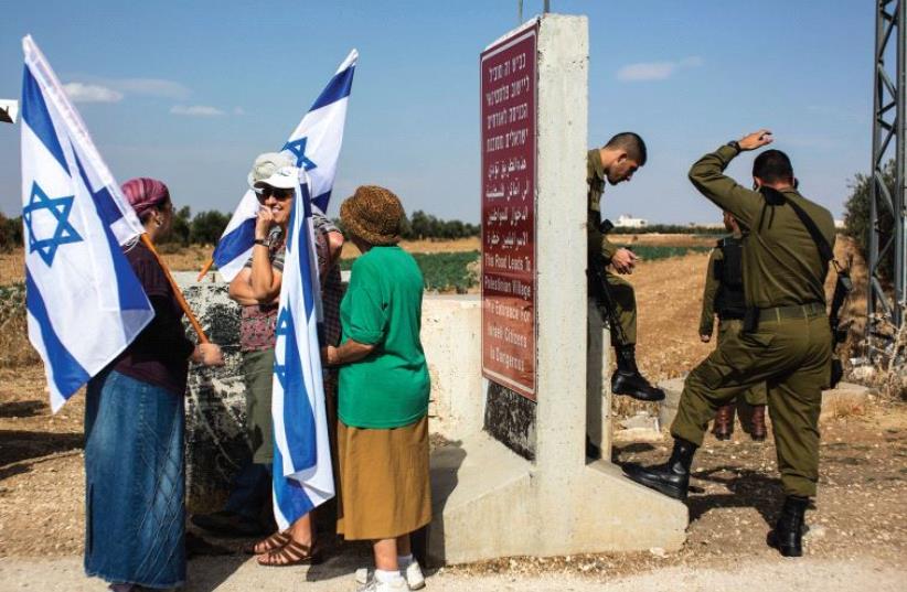 ‘THIS IS what distinguishes nationalism from extreme nationalism. The former protects us from external enemies, whereas the latter focuses on enemies from within our own ranks.’ (photo credit: REUTERS)